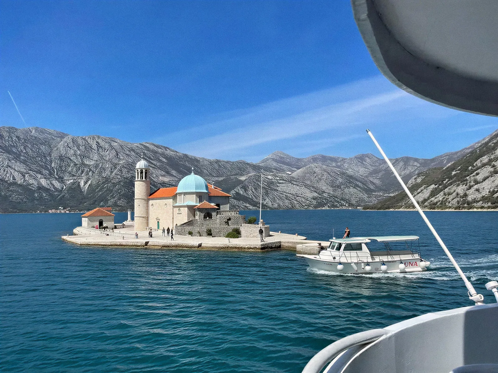 The church of Our Lady of the Rocks, Gospa od Škrpjela, seen from the deck of Katica on the approach from Perast